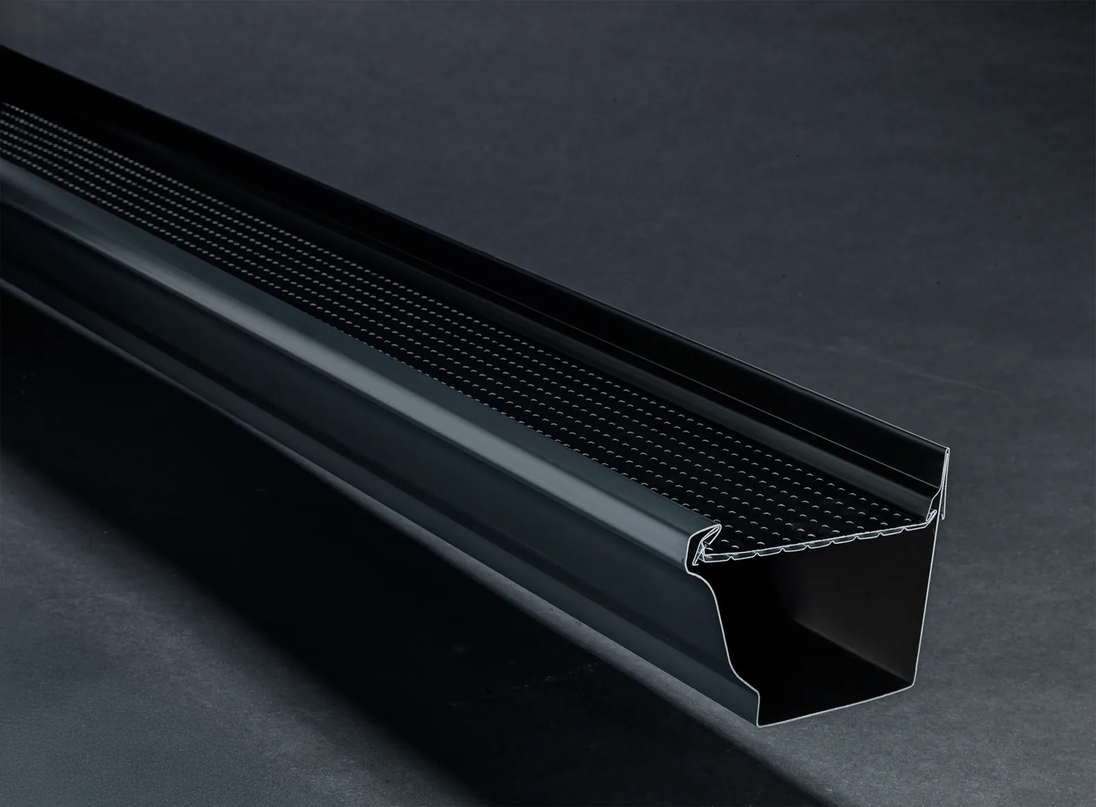 Alu-Rex DoublePro continuous hanger and dual-layer protection shown on a black K-style gutter