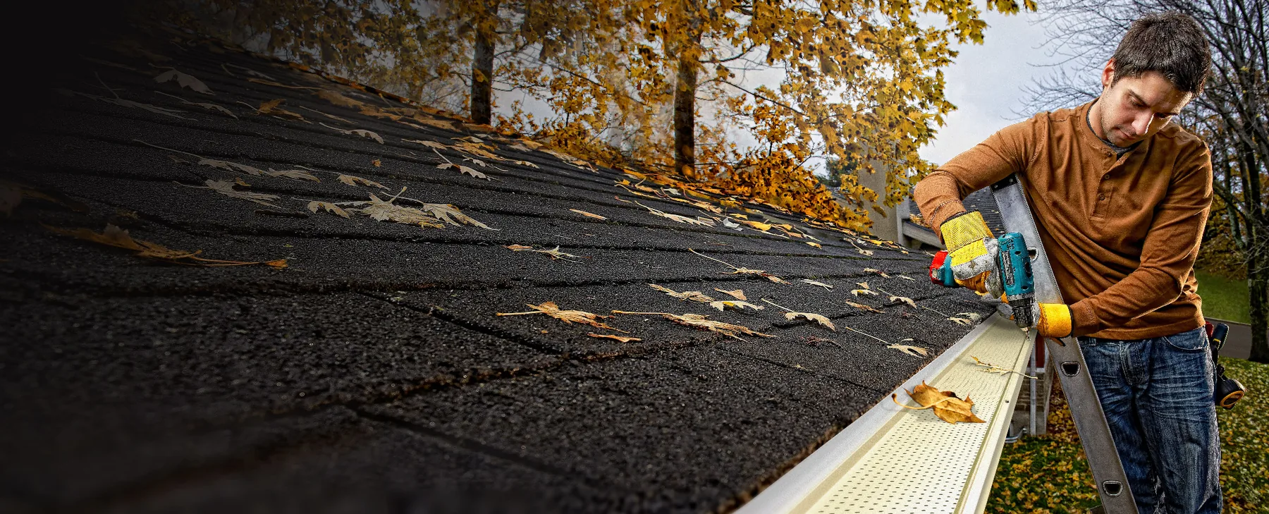 Manufacturer installation image showing perforated gutter protection being fastened along an existing gutter
