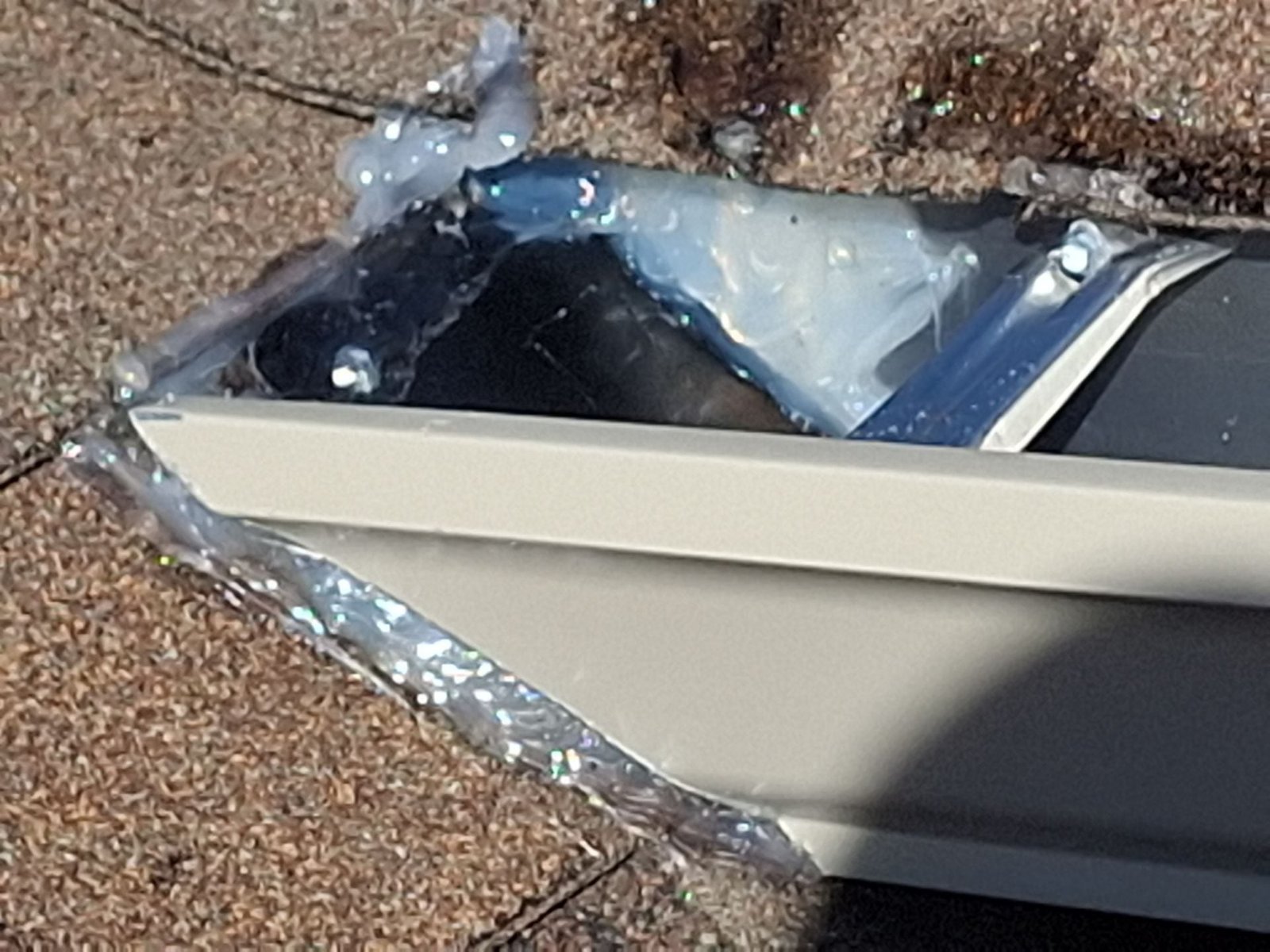 Field example showing heavy caulking and a fastener through gutter material into roofing on a system not installed by McCloud Gutter.