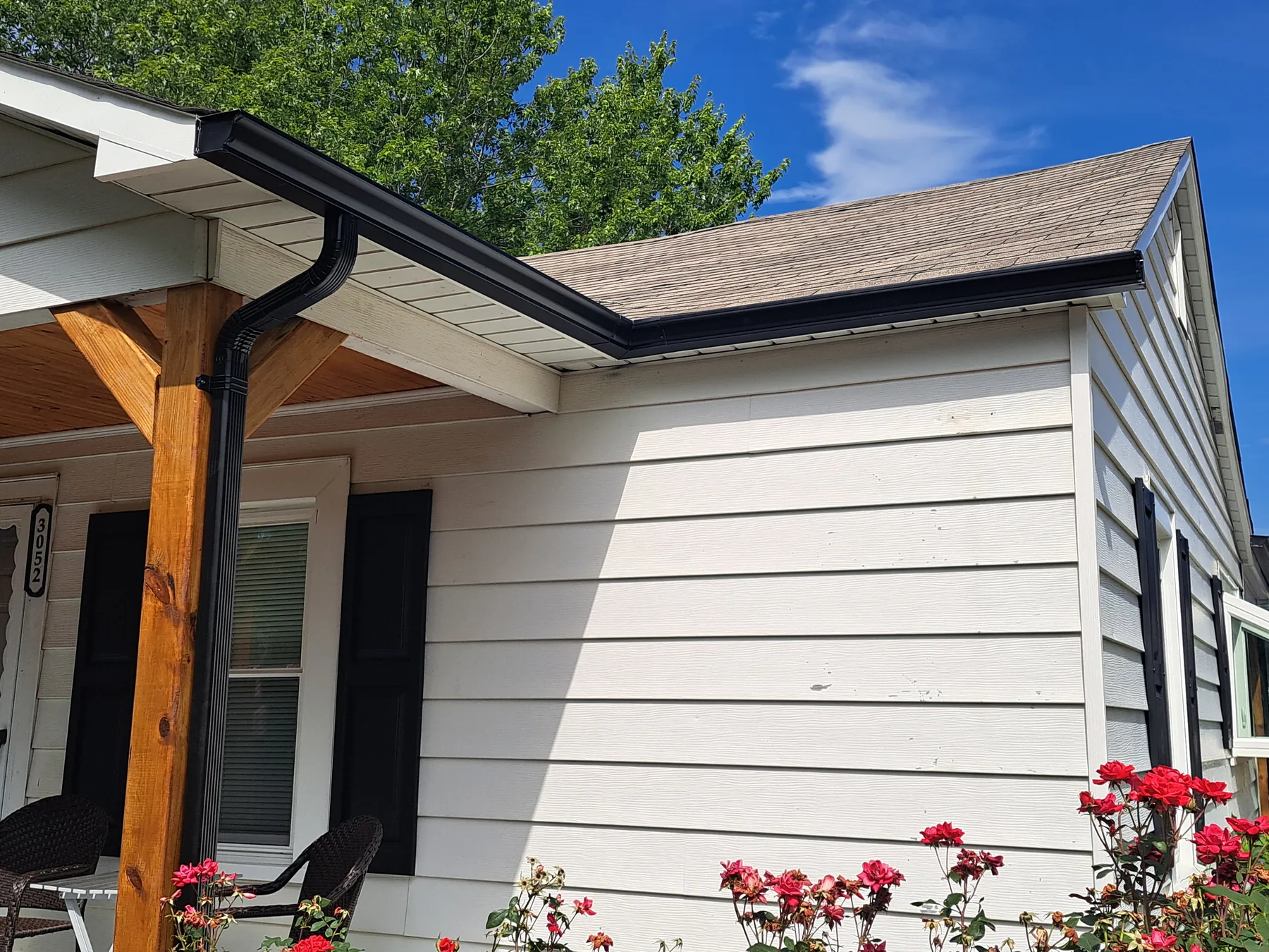 Black 5-inch gutter with 2x3 downspouts in Sawmills, NC