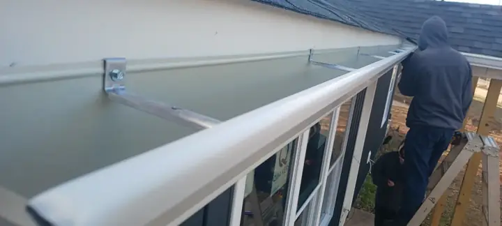 White 6-inch Gutter Being Installed