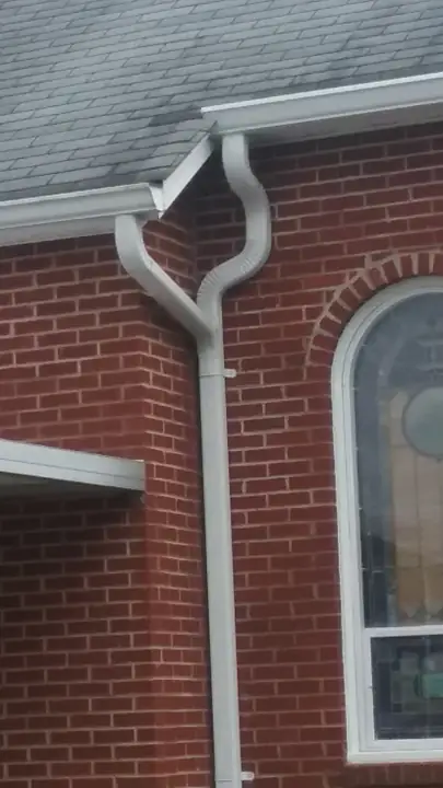 Lenoir church 6-inch gutter with 3x4 custom downspout tie-in