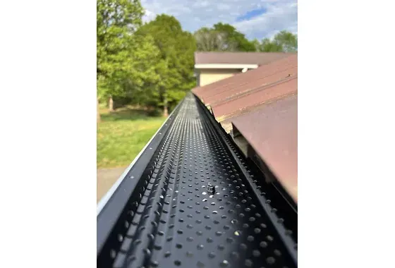 E-Z Smooth Flow gutter guard on a white 6-inch gutter in Conover NC
